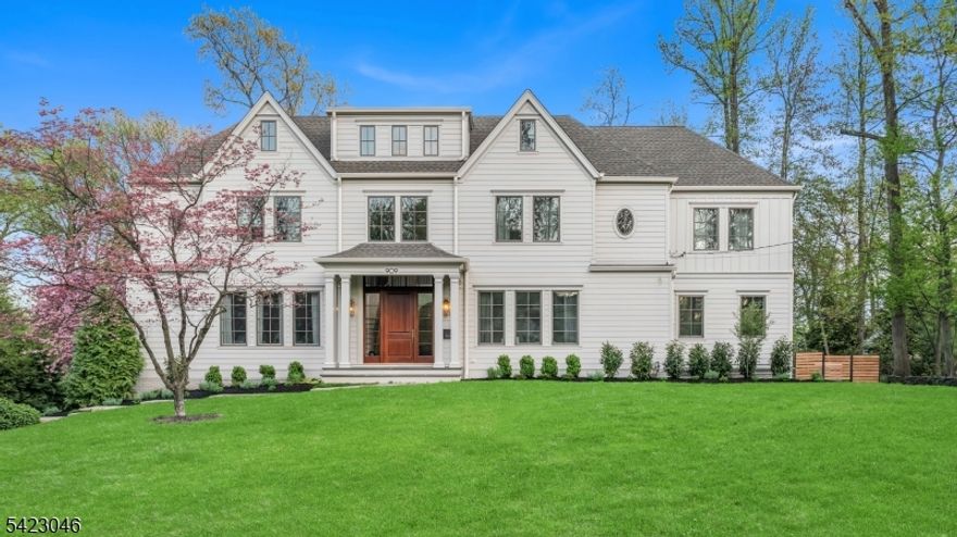 Welcome to this exceptional custom-built home in the coveted Indian Forest section of Westfield, an outstanding opportunity for buyers searching for a home with design, space, and craftsmanship at the highest level. Set on nearly 1/2 acre & created by Michael Roberts Construction in collaboration with Ellie Mroz Design, this residence offers 5,000+ sqft above grade with 6 en-suite bedrooms, including a spacious first-floor guest suite. Every detail reflects refined architectural excellence, from dramatic archways & custom millwork to mixed metal finishes & incredible designer touches. Sunlight pours through oversized windows, enhancing the open, airy layout that flows seamlessly across formal & casual living spaces. The chef's kitchen features high-end appliances, custom cabinetry, and effortless flow for entertaining, while a fully integrated indoor speaker system elevates everyday living. Additional highlights include a private first-floor office, a soaring 19' foyer, elegant formal dining room, family room with indoor-outdoor fireplace & bar. All upstairs bedrooms with en-suite baths and walk-in closets, plus a 6th suite on the third level & a flexible lower-level recreation space. Solar panels on the roof add modern efficiency to this timeless estate. The expansive backyard offers endless potential for outdoor living, making this one of the most compelling luxury real estate offerings for discerning buyers seeking design, lifestyle, and location in one extraordinary home.