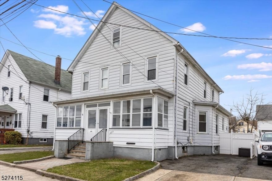 Nicely updated 3 bed 1.5 bath unit Multi-family half duplex. Newly installed laminate flooring throughout. High ceilings, lots of natural light. Entire unit freshly painted. Nicely updated eat-in kitchen with half bath. Second floor has three bedrooms and one full bath. Walk up attic with tons of storage available. Enclosed front porch for extra room to spread out. Drive way can fit one car or two depending on size. Enjoy your own  separate back yard with privacy fence. Beautiful unit must see!