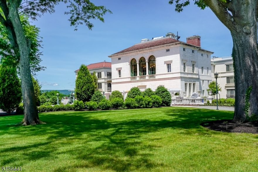 In- town living at its finest! Sunny, Two Bedroom,Two Bath, open floor plan unit with 9 foot ceiling features exquisite millwork, hardwood floors, gourmet kitchen, sumptuous master bath, separate den/library, laundry with full size front load washer and dryer and custom built-ins, 2 sets of French doors with Juliette balconies and a private storage room.  On-site amenities include elevators to all levels, property mgt/concierge on-site, fitness center, billiards, game room, and clubhouse with lounge & kitchen facilities. Private residence garage with 2 reserved parking spots. New restaurant coming to the Mansion, planned for spring 2026. Be one of the lucky few to live in this exceptional in-town 36 unit residence. Shopping, restaurants and NYC trains are just blocks away.