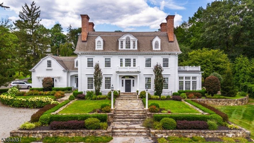 Entering the front gates, this Georgian Revival Colonial, newly built from the ground up in 2000, is sure to impress the most discriminating buyer. The architecture of this home embraces modern day living while staying true to classic early 19th century design. Situated on over 2.5 acres in historic Washington Valley, this stately property offers luxurious living without compromising aesthetics and historical architecture. With the finest appointments and attention to detail, classic old world features compliment new world amenities. Notable features include true-divided custom windows, hand cut wood floors sourced from property felled trees, nine layer crown moldings and extensive millwork, nine working masonry fireplaces and an impressive elliptical three-level staircase which is the heart of this home. Modern day amenities include a chefs kitchen with professional appliances, quartz counter tops, 10' center island and fully equipped butlers pantry. This home is perfect for entertaining year round with extensive blue stone patios featuring an outdoor kitchen, stone fireplace, three-tiered fountain, outdoor lighting and sound system and multiple seating areas for relaxing or dining al fresco. Mature landscaping, specimen flowering & fruit trees, stone walls, a fenced flower cutting garden and more complete the extensive grounds. An impressive one-of-a-kind estate property which must be seen to be truly appreciated and is just minutes to downtown Morristown and NYC direct.