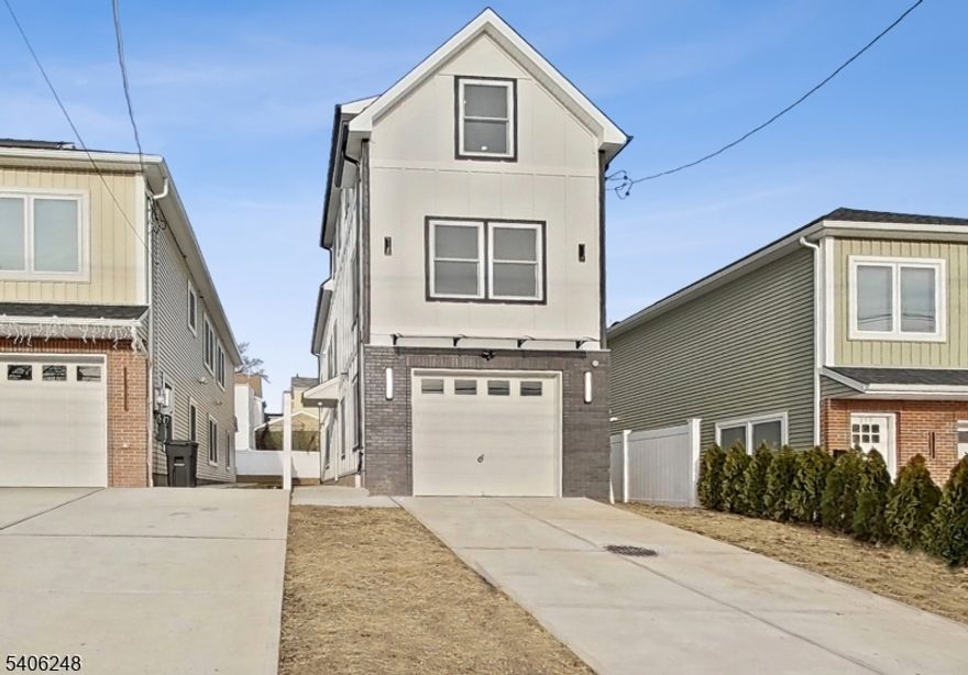 Welcome to 261 Winans Ave! An absolutely striking new construction residence delivering modern design, exceptional scale, & thoughtful versatility. This home offers over 2,575 sq ft of beautifully finished living space that feels even larger than expected. The main living level showcases a sleek, chef-inspired kitchen equipped with a 6-burner 36" professional-style range, a matching high-performance hood, & a 4-door stainless steel refrigerator, seamlessly flowing into a generous center island, dining area, and expansive living space ideal for everyday living & entertaining. Features 3 spacious beds, including a principal suite with a walk-in closet & private bath, plus a flexible fourth bed option currently configured as a large private office perfect for today's work-from-home lifestyle. An impressive game / party room adds exceptional lifestyle value, offering the ideal space for entertaining, recreation, or multi-purpose use. Additional highlights include laundry conveniently located on the bedroom level, an attached garage, & a private backyard, a rare find for a home of this caliber. From the exterior, you would never imagine how expansive & well-designed the interior truly is. This is a true symphony of design features & high-end finishes, standing as a testament to contemporary living with refined aesthetics & functional elegance. This is a home that must be experienced in person. Be sure to explore the 3D Virtual Tour & detailed floor plans we prepared for you.