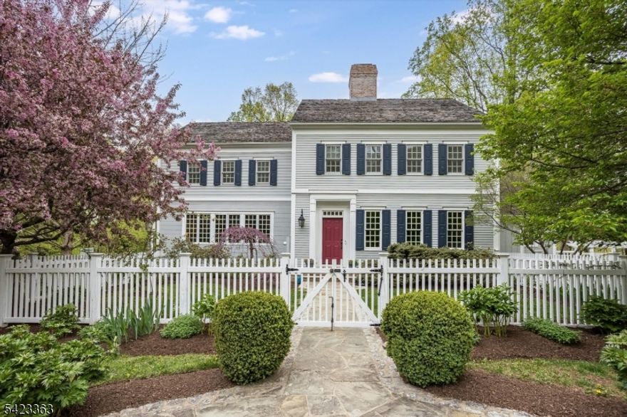 Tucked at the end of a quiet cul-de-sac in Chester's coveted Hedgerows neighborhood-- an intimate enclave of New England-inspired custom colonials this exceptional home offers timeless elegance & modern comfort. Proportioned w/ thoughtfully designed spaces throughout, from the welcoming foyer to the living room accented by a decorative Dutch-tiled fireplace, classic architectural detail meets today's lifestyle at every turn.  The heart of the home is the chef's kitchen, equipped w/ a large center island, double wall oven, gas cooktop, dishwasher drawers, Sub Zero refrigerator & 4 freezer drawers. A sun-filled breakfast room opens to a spectacular screened deck overlooking the picturesque backyard: a true outdoor living room and an absolute showstopper.The 1st floor continues with a cozy family room featuring a WBFP, formal dining room, and a sunroom that enhances the home's warm, welcoming flow.  A standout feature is the large 1st fl office w/ closets & ensuite bath, offering flex use as a guest suite or private work-from-home retreat.Upstairs, the 2nd floor includes 3 spacious bedrooms, 2 full baths, & convenient laundry room.  The 3rd level offers a private bedroom & bath.The finished walkout lower level features a rec room, workshop, ample storage, & powder room, w/ direct access to a fenced backyard & patio. Additional highlights include wide plank wood floors, 3-car garage wired for EV charger, natural gas generator, 1st fl speakers, & Ethernet in all rooms.