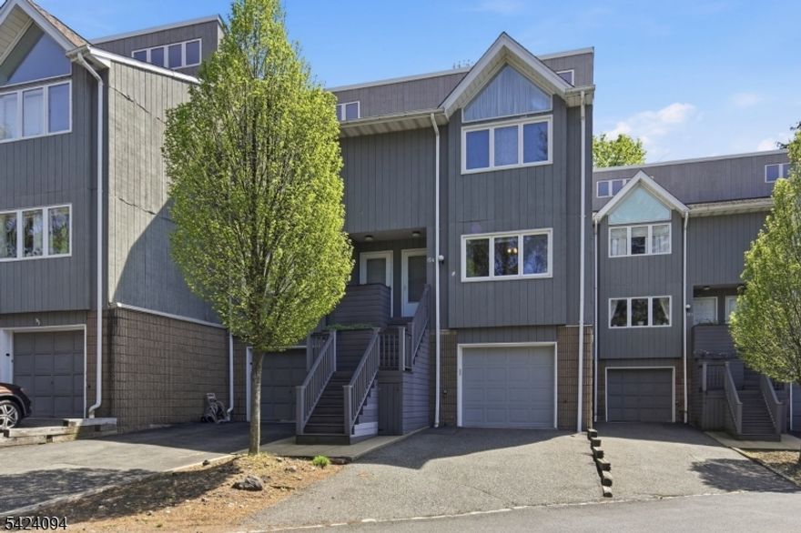 Welcome to 154 Marion Dr, a 2-bedroom, 2.5-bath townhouse in West Orange's Essex Green Villas, offering approximately 1,676 square feet of multi-level living. This townhome features an open-concept kitchen that flows into the main living and dining areas, creating a bright, functional layout for everyday living and entertaining. High ceilings add an airy feel, while mountain views bring a standout backdrop to the space. Upstairs, two bedrooms and two full baths are complemented by a convenient main-level powder room, and the attached 1-car garage adds practical everyday convenience. Located in the Essex Green area of West Orange, this home is close to shopping, dining, and everyday services, including Essex Green Town Center.