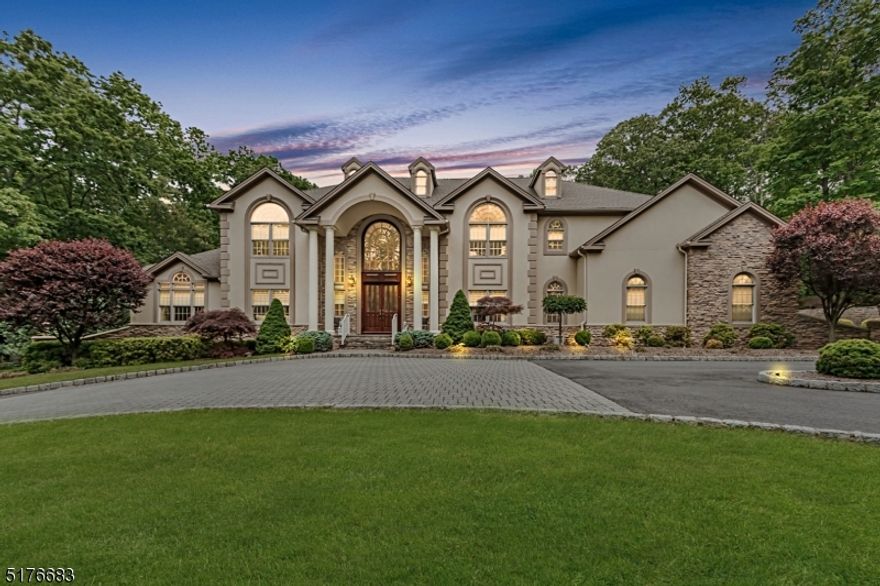 The private 300' driveway lead to one and a half acre secluded property where beauty, excellence, comfort and detail abound. This impeccable Custom Center Hall Colonial features a majestic 2 story marble entrance with double bridal staircase, artisan quality custom trim work, wainscoting and crown moldings throughout. The gracious first level includes a great room w/full service bar and fireplace, parlor/music room, den w/2 sided fireplace, paneled office/library  including wet bar, bedroom w/full bath, formal dining room and fully appointed laundry room. The gourmet eat-in kitchen is an epicurean delight w/top of the line appliances, center island w/prep sink, butler's pantry and sun-lit eating area overlooking the backyard & patio.  The 3rd staircase off the kitchen leads to the spacious 2nd level. The primary suite is complete w/2sided fireplace, sitting/exercise room, 2 enormous custom walk-in closets plus a luxurious bath w/skylight, oversized jetted tub, double shower w/jets, private commode area and double sinks w/dressing table. This level also offers Jack & Jill bedrooms separated by a full bath plus a 4th bedroom w/bath. Finished basement complete w/full kitchen, areas to play, lounging, home office/bedroom, media & storage. The extraordinary backyard has an expansive paver patio w/fire pit, hot tub w/open gazebo with wet bar. Perfect to entertain or just relax in this Shangri-La setting. The garage, w/lift, houses 4 cars. House provides 5 zone HVAC