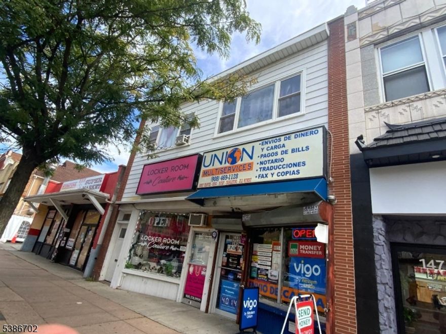 3 apartments, 2 stores 400 sq ft garage front rear unfinished basement. $9,150.00 monthly income all separate utilities some renovations past years electric 2013, roof 2021, 3 hot water tanks 2021 vinyl windows, concrete backyard with easement from left side drive through access for parking.