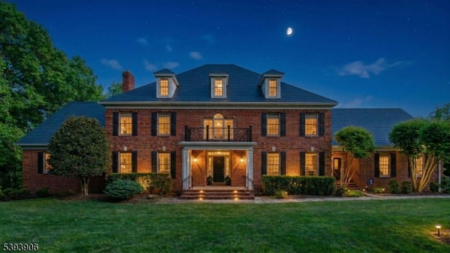 Set on a private lane, this stately 6 BR, 6.2 BA colonial captivates at every turn. Dramatic 2-story foyer leads to an open flow, high ceilings, gracious rooms, wood floors, abundant windows & ample storage. Spectacular great room hosts soaring ceiling, impressive stone fireplace, wet-bar w/wine refrigerator & vast French doors to back deck. Eat-in-kitchen has skylights, SS appliances, breakfast bar & another set of French doors to deck. Elegant living, dining & powder rooms make entertaining easy & home office boasts privacy & sweeping vistas. First floor primary suite provides a luxurious retreat w/lighted tray ceiling, sitting area, 2 custom WIC's & vast spa-like BA w/double vanity, jetted tub, stall shower & private WC. Laundry, another 1/2 BA & direct access to oversize 3-car garage w/newer doors complete the main level. Grand foyer staircase or back steps lead to the 2nd floor landing overlooking foyer & great room w/access to pull-down attic (architectural plans exist for 3rd level expansion). Additional private spaces include another primary BR suite w/skylights & new spa bath w/barn door & double vanity plus 4 more spacious bedrooms, each with ensuite bath & WIC. Recently finished walk-out lover-level hosts office, gym, leisure, storage & utility areas. TESLA solar roof & power wall off-set electricity costs. Back yard offers wooded privacy w/vast front & side yards. Enjoy luxury living with a coveted, close to everything location!