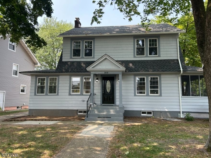 Pack your pillow.  This is the one.  A fabulous newly renovated colonial on a handsome tree lined street!Spacious sun drenched living room offers a wood burning fireplace and connects to a separate dining room.  The open concept kitchen has a modern rustic vibe-perfect for entertaining.  Right off the living room is a sun room that has a wall of windows-ideal for an office or guest room while a second sun porch is the perfect spot for a morning coffee.  The back deck invites you to enjoy the deep and level backyard.  Three nice sized bedrooms are on the second floor while the newly finished walk-up attic can be used as another bedroom.  The renovated dry basement is the perfect recreation room with a half bathroom.  The utility room houses y our new furnace and a brand new Navien tankless water heater-to keep your bills on the gentle side!  New roof, central air, plumbing and electric for your ease and comfort.  The driveway leads you to the detached two car garage for added convenience.  This is NOT A FLOOD ZONE!  Thank you for your consideration.