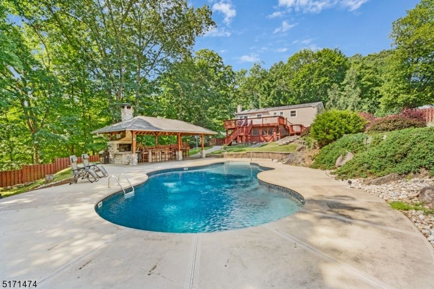 Welcome home to 58 Mountain Heights Drive in Byram Township with Sparta mailing address! This peaceful and private 5 bedroom 3 full baths situated on more than 1 acre of land.  Large living room leading into light filled renovated kitchen with granite countertops is a wonderful space for hosting. The kitchen slider doors open to the deck. Walk down the staircase to the paver patio to enjoy a dip in the in-ground salt water heated pool (installed in 2008 with upgraded in 2020) with outdoor gazebo featuring wood fire grill & pizza oven for entertaining. Yard is fenced in with cedar wood fencing. Walk back inside through the screen in porch underneath the deck to the ground floor. A large family room with gas fireplace (2018) awaits as well as an additional two bedrooms & full bathroom renovated  as well as access to the one car garage, laundry area, and dog bath. Shed on property features generator hook up. Roof is 5 years young! House also has water softener & reverse osmosis (2021), tankless hot water heater (2020), and natural gas available in the street. TRULY AMAZING home & Backyard Oasis. A MUST SEE!