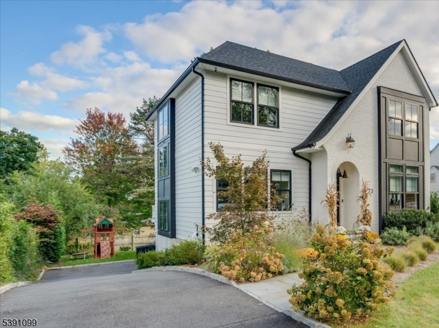 2021 custom-built home where luxury feels effortless. Crafted by a premier local builder known for exceptional design and detail, elevated by the owners' discerning eye, every finish was hand-selected to create a space that feels both sophisticated and deeply livable. At the heart of the home, the chef's kitchen blends beauty and function with custom cabinetry, a butler's pantry, wine fridge and another spacious light-filled pantry with even more custom cabinetry and 2 built-in refrigerator drawers. A built-in breakfast bench adds charm and extra storage, while expansive sliders extend across the family room, opening to the outdoors and bathing the space in natural light. The first floor flows gracefully across white oak floors, connecting the kitchen to the inviting family room with fireplace, a welcoming living room, and a private office or guest bedroom. Upstairs, the primary suite is a serene retreat with a gas fireplace, dual walk-in closets, custom built-ins, and a spa bath featuring radiant-heated floors. Three additional bedrooms, hall bath and a conveniently located laundry room complete the 2nd floor. The lower level offers additional flexibility. Here you will find a playroom, the 6th bedroom and full bath -ideal for guests, hobbies, or recreation. With 6 bedrooms, 3.5 baths, 2-car garage, a spacious level back yard and every modern comfort, this home was designed for the way people truly live-seamless, stylish, and enduringly beautiful.