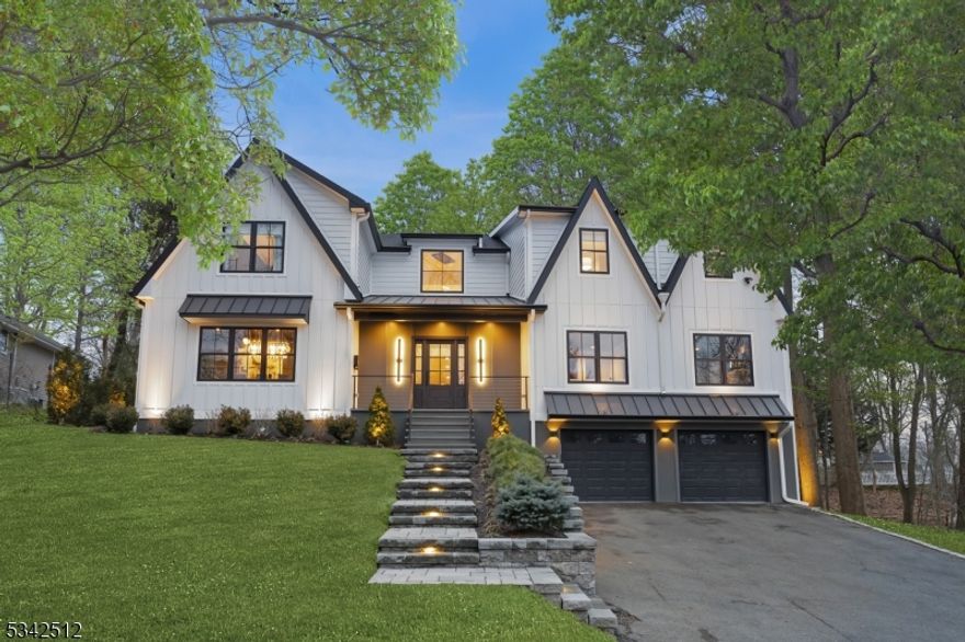 Unparalleled Luxury in Short Hills! Step into sophisticated modern living with this breathtaking designer home. A grand double-story foyer welcomes you into a sun-drenched open floor plan with extra-large windows & floor-to-ceiling glass doors seamlessly blending indoor and outdoor spaces. At the heart of home is its state-of-the-art chef's eat-in kitchen, boasting exquisite omega cabinets & countertops, 7 burner Italian stove, 30" panelled refrigerator and freezeer combo, custom glass backsplash, walk-in pantry, & a sleek butler's pantry leading to an oversized formal dining room perfect for culinary & entertaining enthusiasts. The expansive family room leading to a tucked-in sunroom with its 2-sided contemporary gas fireplace is a serene retreat year-round. Large private home office overlooking the street, connects to the living room through glass pocket doors, and a first-floor guest suite. Every inch of this home is curated with exquisite details, from Venetian plaster walls, white-oak herringbone floors, & pocket doors with reeded glass. Each en-suite bedroom features custom closets, while the primary suite is stunning with a private balcony, 2nd home office, & spa-like bath with steam. The expansive deck offers a private oasis for lavish entertaining or quiet contemplation. The fully finished walkout basement offers a rec-room, gym, & en-suite bedroom. This home is a beautiful enclave steps from top-rated schools, this home effortlesslycombines modern luxury & elegance