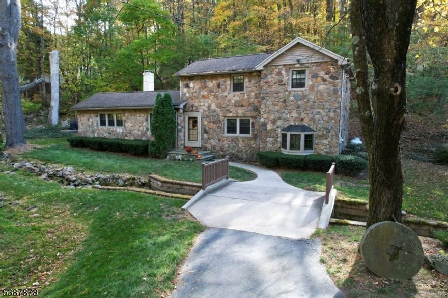 Welcome to 63 Sanatorium Road, where classic stone home charm meets the natural beauty of Hunterdon County. Set alongside a gentle brook, this home offers a peaceful and inviting setting you'll fall in love with. Inside, you'll find an updated kitchen, warm wood floors, and a flexible layout with a first-floor room currently used as an office that could easily serve as a third bedroom, complete with a full bath. The living room, dining room, and family room provide comfortable spaces for everyday living and entertaining. Upstairs features two bedrooms and a full bath. With its unique character and serene surroundings, this home is truly a special place to call home.