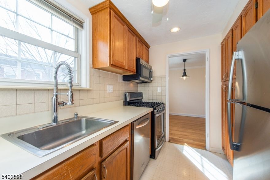 Welcome to this freshly painted FIRST FLOOR 1 bedroom, 1 bath condo in the desirable Springtop Community. This move-in-ready unit features hardwood floors, generous closet space, wall-unit AC in both the living room and bedroom plus convenient in-unit laundry.  The kitchen is equipped with stainless steel appliances including a gas stove/oven, microwave, and refrigerator. One parking pass is included (parking is first come, first served).    Springtop is conveniently located near major highways, shopping, dining and the Short Hills train station with direct access to New York City. Tenant responsible for first $200 of each repair.  Cats Allowed. No smoking.  Available immediately.  This one won't last!