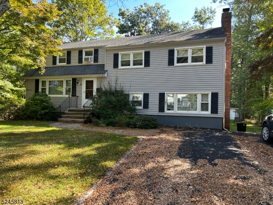 Very special opportunity to purchase this Spacious 4 Bedroom Split level home located on a cul de sac street within walking distance to the heart of Morristown. There is a tenant with an in place lease until 5/31/2024.  This home offers a Living room and Dining room w/ sparkling, refinished hardwood floors, eat-in Kitchen, new S/S appliances.Lower, walk out level has a huge Family Room, 1/2 bath and full wall Brick FPL, newer w/w carpet. There are 3 bedrooms and a full  updated bath on the 2nd level, the Primary bedroom suite is on the 3rd level with a full bath..Partially finished basement..NEW DECK, overlooking gorgeous park like backyard.  This home has been a very successful investment property for many years, thus a great opportunity for investors, OR purchase to use and enjoy some income .A very much in demand location, shopping, restaurants, entertainment, and all Morristown has to offer.   Public transportation and proximity to hi-ways..A win win..!!