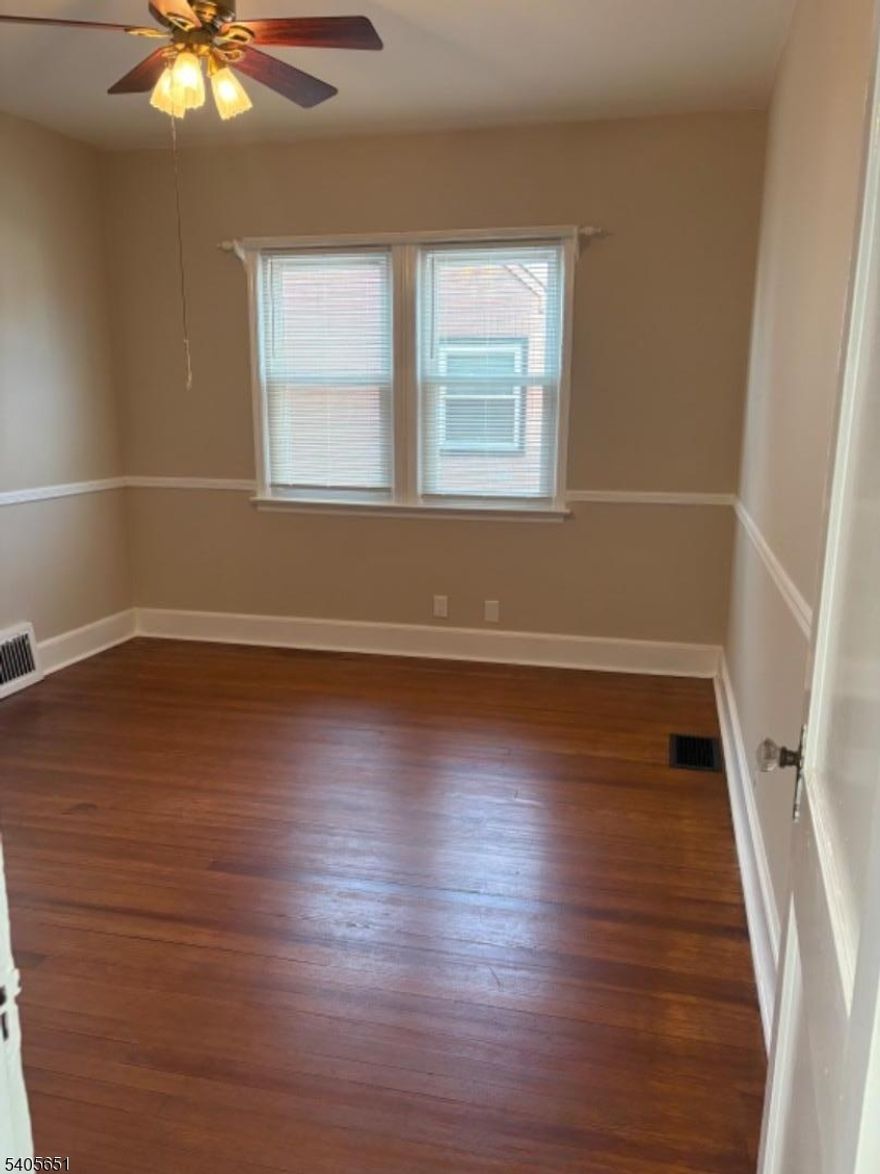 If you are looking for a mint condition move right in picture perfect home stay on this page!  Refinished natural pine wood floors ...all newer thermal windows,  wonderful huge backyard to enjoy.  quiet residential street .walk to NY bus. elementary school, shoppes, and more! You will love the spacious living room, formal dining room and eat in kitchen..live in convenient Linden .. this home has super affordable taxes!!!!  This one will be quite popular so call us for details and appt!