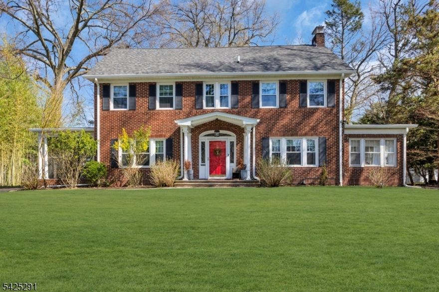 Set on a generous property within the sought-after Montrose Park Historic District, this distinguished center hall Colonial offers a seamless blend of classic design and modern refinement. A welcoming foyer introduces a series of elegant living spaces, including a front-to-back living room with a wood-burning fireplace, custom built-ins, and French doors opening to a sunlit den and private terrace. Designed with both everyday living and entertaining in mind, the formal dining room connects to a screened porch, while the updated kitchen, featuring quartz countertops and stainless steel appliances, flows into a bright breakfast room with a bay window overlooking the backyard. A mudroom and powder room complete the main level. The second and third floors include five well-appointed bedrooms, three full bathrooms, and a versatile office space. The finished lower level features a recreation area with wet bar, laundry, powder room, and a sauna with steam shower, offering a private, spa-like retreat. A detached three-car garage allows for additional storage. Conveniently located near South Orange Village, parks, and NYC trains. Be sure to review the full list of updates.