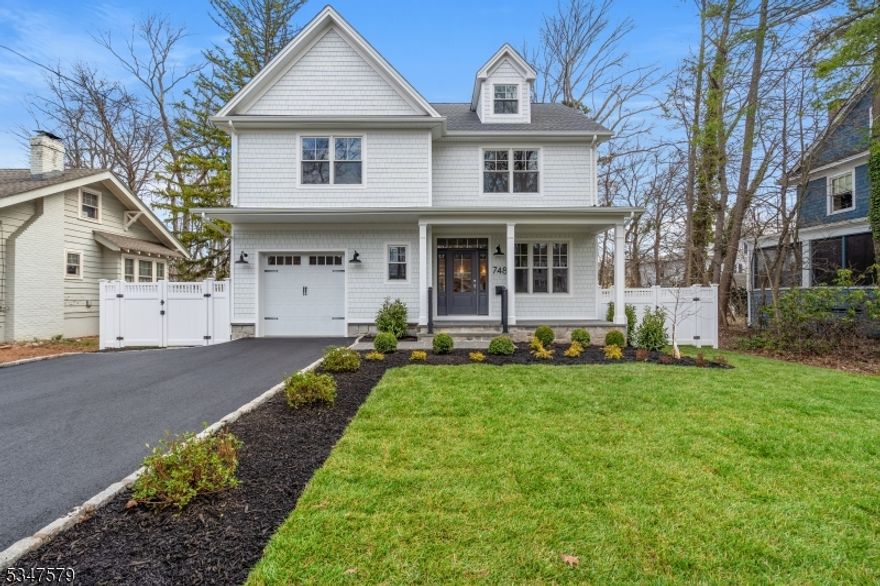 BRAND NEW CONSTRUCTION home with 10 YEAR BUILDERS WARRANTY! Home built by Elshiekh Custom Homes. Gorgeous 6 Bedroom, 6 and a half bath Custom Colonial home with approx. +/- 5,143 sf of finished living space on 4 floors, Custom Detailed Millwork, Coffered Ceilings and Superior Craftsmanship Throughout. Enter the home to see a formal Living Room & Dining Room with extensive Millwork. Rich hardwood floors which lead to expansive Kitchen and Family Room with a gas Fireplace equipped with surround sound speakers; sliders to a covered/uncovered blue stone porch overlooking the oversized backyard. Chef's kitchen is complete with GE MONOGRAM appliances, a large center island, quartz counters, custom cabinetry & Beverage Center. The first floor is complete with a Mudroom, Powder Bath, & First Floor En Suite Bedroom. The 2nd floor is home to 4 Bedrooms, 3 Full Baths & a laundry room. The Primary Bedroom is designed with a tray ceiling, TWO spacious walk-in closets & spa-like bath with a soaking tub, stall shower and double vanity. The 3rd floor houses an additional Bedroom & a Full Bathroom that provides ample space for guests or an ideal home office space. The finished Basement is equipped with a huge Recreation room & full Bathroom. Home also includes a hardwired alarm system throughout for your comfort and convenience. No expense spared when building this stunning abode!