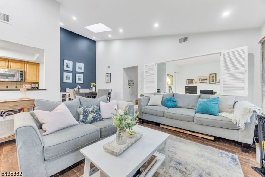 Welcome home to this beautifully updated end-unit condo in the sought-after Fieldstone section of The Hills. Filled with natural light, this inviting residence showcases soaring cathedral-style ceilings, updated LED lighting, and a skylight over the dining area, creating a bright and airy atmosphere throughout. This unit offers 2 spacious bedrooms, including a primary suite featuring a walk-in closet and a private powder room vanity, adding both comfort and convenience. The updated kitchen is appointed with quartz countertops, stainless steel appliances, and stylish neutral finishes. Experience resort-style living with access to exceptional community amenities, including a clubhouse, pool, tennis courts, fitness center, and scenic biking and jogging paths. Ideally located with convenient access to Bridgewater Commons, Morristown, Short Hills, the Prudential Center, and major highways including Routes 287, 206, and 78. Come experience the lifestyle that makes The Hills so desirable schedule your showing today before this one is gone.
