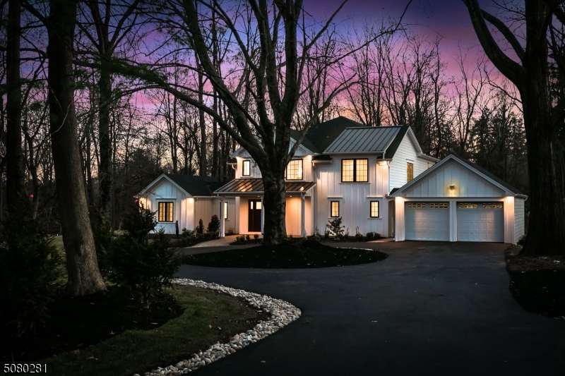 Renovated to perfection with 3,800 square feet of sophisticated living and entertaining space, this gem has it all! The circular driveway leads to the welcoming front porch of this spectacular 5 bedroom, 5 bath custom colonial. The open floor plan exudes classic charm and showcases superb craftsmanship and attention to detail throughout. The chef's kitchen with a large island, quartz countertops and top of the line stainless steel appliances is open to the gorgeous family room which features a coffered ceiling and French doors to the rear patio. The kitchen also provides direct access to the formal dining room which is adorned with elegant millwork. Enjoy gatherings in the living room which boasts a gas fireplace with a custom wood mantel and surround. The first level also offers a bedroom/office, full bath and mudroom with laundry area. The voluminous master suite boasts a private balcony, tray ceiling, custom-fitted closets and a luxurious bath. Three additional bedrooms, one en-suite, and another full bath complete the second level. The finished lower level has a family room, rec room, full bath and an abundance of storage. This stunning home is situated on nearly an acre with a private back and side yard and is close to shopping, parks, restaurants, and transportation in an award-winning school district. (Structural home warranty offered. Shared driveway easement.)