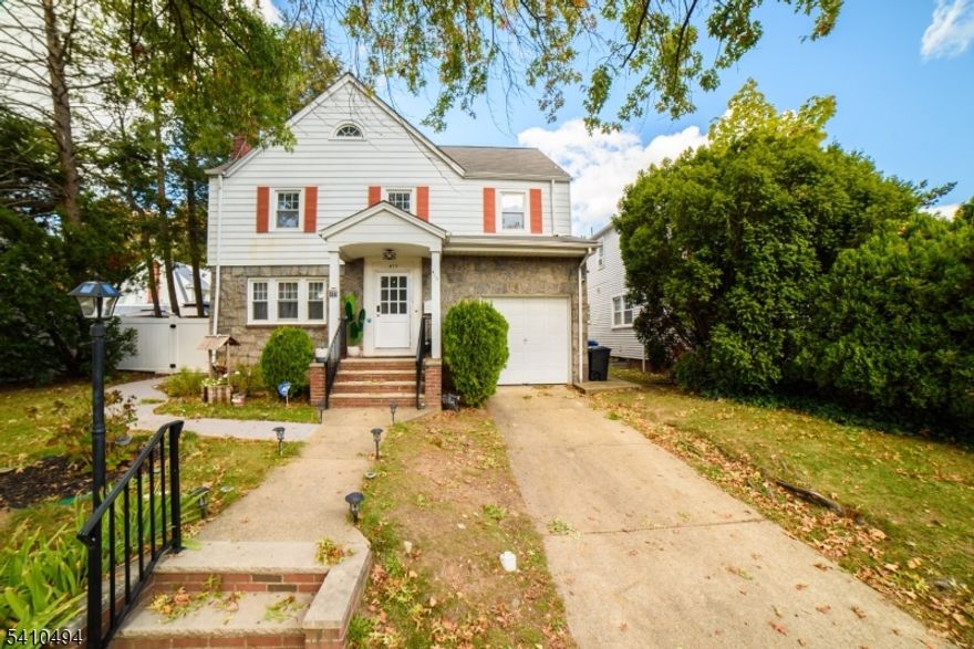 Beautifully Renovated Eastside Gem!Discover this stunning, move-in ready home located in Paterson's desirable Eastside neighborhood just a short walk to Eastside Park! Nestled on a picturesque, tree-lined street, this home offers easy access to Route 20, major highways, and public transportation.The first floor features a spacious living room, formal dining area, and a beautifully renovated eat-in kitchen with a convenient half bath. Gleaming hardwood floors flow throughout. Upstairs, you'll find four generous bedrooms and a full bathroom, offering plenty of closet space and abundant natural light. A walk-up attic provides an additional large bedroom perfect for guests, a home office, or a creative studio.The finished basement includes a bedroom, full bath, and extra living space with a private entrance ideal for an in-law suite. Enjoy your backyard oasis and make it your own outdoor retreat! An attached garage with interior access through the kitchen adds the ultimate convenience. Don't miss the opportunity to make this beautifully updated home yours!