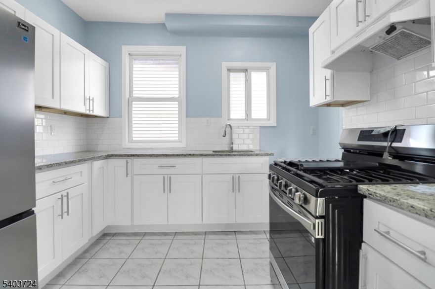 Welcome home to this newly and beautifully renovated 3-bedroom, 1-bath apartment featuring a versatile bonus room perfect for a home office or walk-in closet, plus a sunroom to relax and enjoy the sunshine. The home offers beautiful floors, plenty of windows for natural light, and abundant closet space, including a spacious and bright room that can be used as a pantry or extra storage. Enjoy a brand-new kitchen with soft-close cabinets, potential for in-unit laundry (to be negotiated), security cameras for added peace of mind, and assigned parking available for $50/month. Located on a quiet street with ample street parking, this move-in-ready home is available to make yours TODAY!