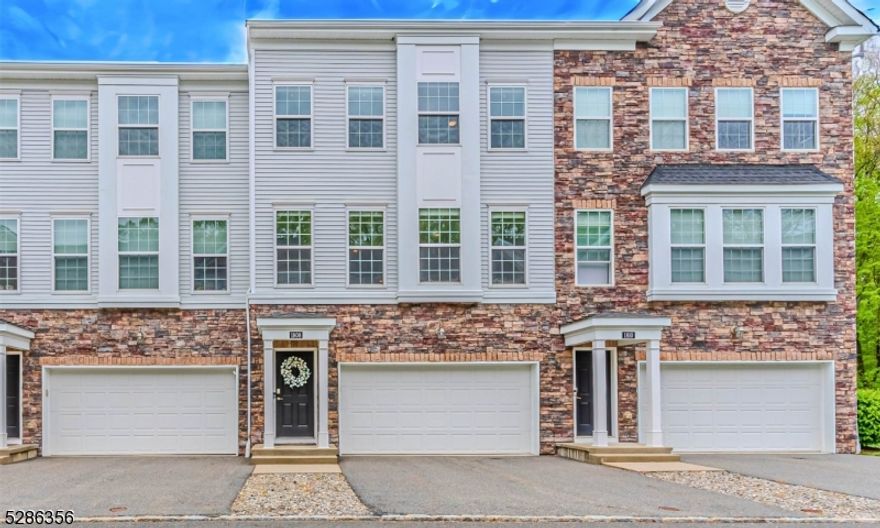 Located amid natural beauty- Community nestled within 52 acres of Natural Preserve. This spectacular townhome offers residents light, bright & OPEN living on desirable Devon Lane, a  quiet, cul de sac w/only a few other homes. Conveniently located in Rockaway Twp which provides easy access to major highways, NYC Direct Train Station & buses for an easy commute yet all the charm & benefit of small town living close to Denville's bustling Broadway Ave. Desirable & luxurious Pinehurst Model floor plan. Over 2100 sqft. Beautiful engineered hardwood floors. Family room & full bath on the 1st floor. Optional guest suite w/private entrance. Easy garage access & walkout to back patio w/large grassy area. Head on to the main level which offers the open concept kitchen, dining & living room. Custom kitchen w/modern 42" raised panel cabinets, granite countertops, center island & Chef's grade stainless steel appliances flow to the large dining & living area. TONS of natural light with oversized windows. Access to the private back deck. Upstairs, a primary bdrm w/full bath & walk-in closet. Rainfall shower & tile bench. Two additional generous sized bedrooms & full bath with tub shower. Marble sinks. Convenient laundry. Pristine condition. Less than 7 years young! The attached 2 car garage offers extra storage & a dedicated driveway. Private entrance/landing. Thermal windows & doors. Smart Home Technology. HOA only $269 a month! Wonderful community with curbs & sidewalks. Playground too!