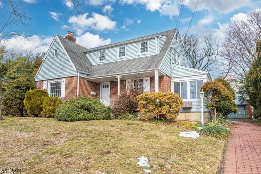 This Colonial home sits on an expansive 75x128 lot, exceptionally sized for homes of its type and size.  This 3BR/2.5Bath home features lovely wood floors throughout, a formal dining room, both a Living Room and a Family Room/Den, as well as a charming 4-season Sunroom with heat and A/C. This sun-filled and relaxing space boasts a stylish brick wall and contiguous windows.  This special home has all of the prized features for which a Buyer would be looking: a great floor-plan flow, an inviting front porch, a large yard that can be enjoyed from the patio, a detached  2-car garage, and a paver driveway. The Bedrooms are generously-sized, and 2 of the 3 have walk-in closets.  The partially finished Basement is comprised of a large open space, only limited by one's vision.  The HVAC system, as well as the Hot Water Heater, are newer.  An additional impressive bonus feature is the NYC skyline view that can be enjoyed from one of the upstairs bedrooms!  Come, take a tour, and be inspired to put your own signature on this notable home, located in a desirable part of town, close to shopping, restaurants, parks, and schools. Your new home and lifestyle beckon!