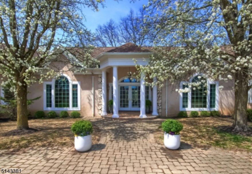 Indulge yourself in this elegant and inviting estate nestled within 4 parklike acres. Spectacular high ceilings throughout this 4 bedroom, 4 full bath retreat. Each sunlit room has an abundance of thermal windows, skylights, and paned glass double French doors to enhance the natural light and breathtaking views. Enjoy your cooking experience in your large gourmet kitchen with granite countertops, center island, premium cabinetry and appliances, wet bar, oversized walk-in pantry and sliding French doors out to the patio great for entertaining around the entire home. Relax in the sun-drenched Parlor and family room with floor to ceiling stone fireplace. The majestic master bedroom includes sitting area with gas fireplace, dressing area with wall to wall closets, full bath with soaking tub, double stall shower and more. A portion of the second floor, has just been finished offering an Office/Bedroom and gorgeous full bath. Additional space awaits to be finished if looking to increase the living space 1000sq' to a total of 6400 sq' of Luxury. Voted one of the "Best Places to Live" and "Top Rated Schools" minutes from the mid-town direct train line, major highways, walk to Loantaka Park or take a scenic stroll around Giralda Farms to Madison's fabulous downtown center with lots of food and shopping. Home is sold "as is."