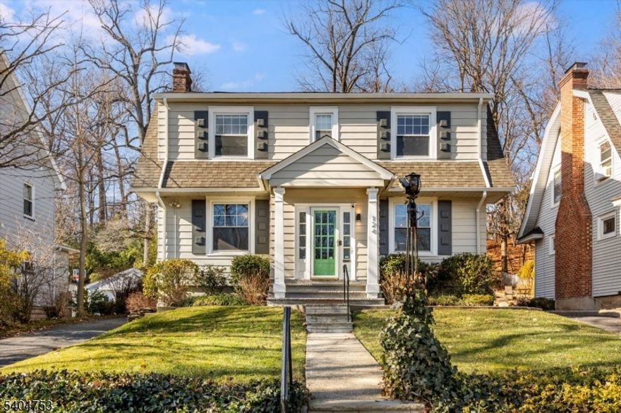 Sitting pretty on a prime Glen Ridge street, this inviting Center Hall Colonial is truly move-in ready. The first-floor layout is open and airy, with the living room flowing into a spacious family room offering direct access to the deck and backyard. The updated kitchen features upgraded stone countertops and stainless steel appliances, with a breakfast bar that provides seating and opens to the dining area. A full bathroom and convenient mudroom complete the first floor. The second level offers a rare four-bedrooms-on-one-floor layout, along with a full bathroom. Hardwood floors run throughout the home, while central air conditioning ensures comfort in every season. The finished portion of the basement provides valuable additional living or recreational space, along with abundant storage and a dedicated laundry room. The backyard is not to be missed. The deck areas lead to a deep, tiered yard that feels like your own private park. Lovely gardens and a charming storage shed are the perfect finishing touches. Enjoy easy access to the downtowns of both Montclair and Bloomfield, plentiful NYC commute options via train or bus, and close proximity to top-ranked Glen Ridge public schools.