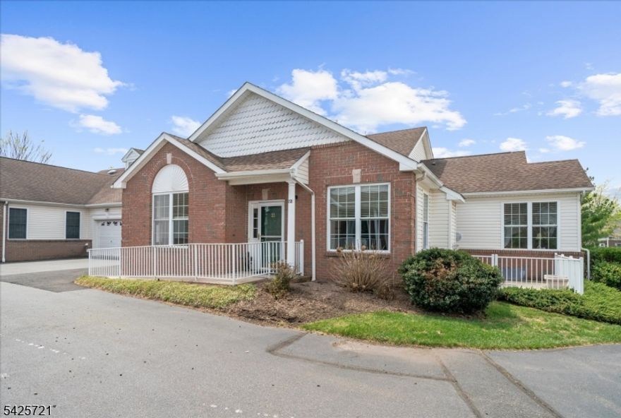 Rarely available Buttercup II model in the sought-after Flemington Fields 55+ community, presented in immaculate condition. This largest model offers an ideal blend of space, comfort, and low-maintenance living with 3 bedrooms and 3 full baths.A bright, sun-filled interior features a spacious first-floor primary suite with full bath and walk-in closet, along with a second generously sized bedroom and adjacent full bath perfect for guests or flexible living. The inviting living room with gas fireplace and hardwood floors throughout the entire first level creates a warm and open feel.The upgraded kitchen boasts quality cabinetry, granite countertops, and premium appliances. Upstairs, a third bedroom, full bath, and versatile loft area provide additional living space, along with ample storage. Custom California Closet systems are found throughout the home.Enjoy outdoor living on the large patio, plus the convenience of a full basement offering excellent storage or future finishing potential. A two-car garage with openers completes this exceptional home.