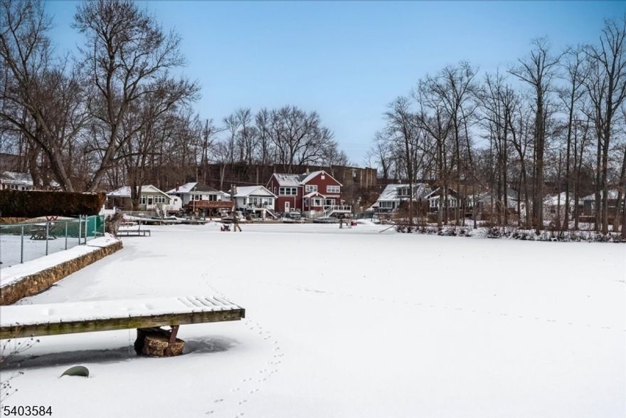 Opportunity Knocks on Indian Lake: Restore Your Lakeside Dream!  Seize a rare "as-is" opportunity to own a piece of paradise right on the shores of serene Indian Lake. This ranch-style home is a renovator's special, offering unparalleled potential to create the lakeside retreat you've always envisioned.  A project with incredible payoff and breathtaking scenery, this is the property you've been waiting for.  A sunroom spans the entire rear of the house, offering panoramic views of the morning sunrise over Indian Lake.  Front-to-rear open floor plan connects the kitchen and family area an ideal layout for modern living and entertaining once updated.  Six sliding glass doors lead from the sunroom directly to the potential site of a future deck, perfect for indoor/outdoor lakeside living.  This house is part of an estate and requires significant care, updates, and repairs. It is being sold strictly as-is.