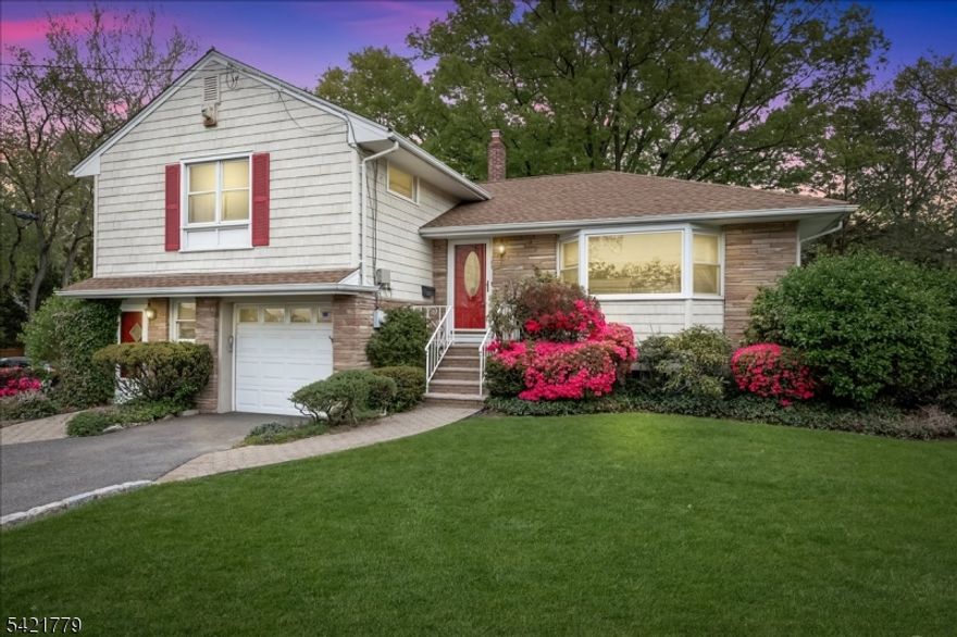 Opportunity knocks , first time offered after more than 70 years of pride in ownership! Conveniently located across from Walnut ave elementary school this .18 acre corner lot is within walking distance to award winning downtown Cranford and mass transit. This 4 level home was custom built and has a rare sunken Living room, formal Dining room, Eat in Kitchen and a Family room w/ hand crafted built-ins & coffered ceilings. There is a Primary suite with plenty of closet space, custom built-ins ,a full bath as well as 2 other bedrooms and a full hall bath. The ground level ,once used as a home office with a "true" separate entrance but is still connected to the rest of the home has tons of potential and awaits your imagination that features multiple rooms, powder room ,enclosed porch and the entrance to the garage. There is a finished basement with plenty of storage and a laundry area. Yes to central air, custom woodwork, hardwood flooring under carpet in living room, hall and primary suite, new HW heater 2025, Roof(2022), vinyl shake siding, replacement windows and more. This is not a drive by, must see, NOT IN A FLOOD ZONE.