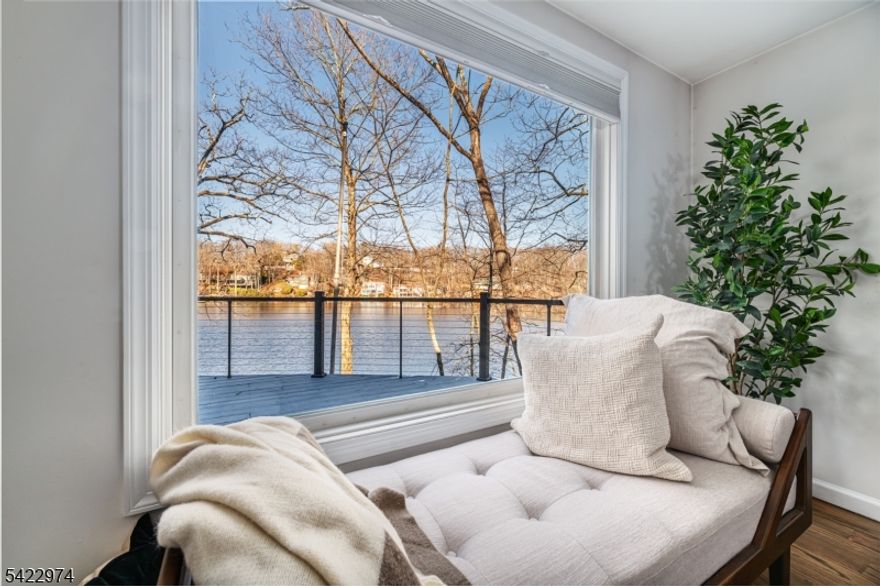 Luxurious lakefront retreat ready for you to enjoy.  This One Bedroom + Loft boasts a private location with 130+ feet of lake frontage and is under an hour from Manhattan.  Year-round lake views are enhanced by a wall of windows, and the home's open concept allows for views from every room.  Hardwood flooring, modern updates and a gorgeous stone chimney provide a lakestyle-chic vibe to this one-of-a-kind home.  Outside, entertain on an enormous deck that spans the length of the home, or swim, fish, or kayak from your private dock.  Recent upgrades include a new roof (2023), leaf gutter system, a fully insulated basement dehumidifying system, security system, and a water filtration system.  Highland Lakes is an active private lake community offering 5 lakes and 7 beaches, swimming, boating, multiple sports courts, playgrounds, clubhouse, year-round activities and more.  Minutes from Warwick, NY with an abundance of restaurants, wineries, and a drive-in movie theater.  Enjoy nearby ski areas, waterpark, championship golf and hiking. The perfect location to actively enjoy nature. LIVE THE LAKE LIFE THIS SUMMER !