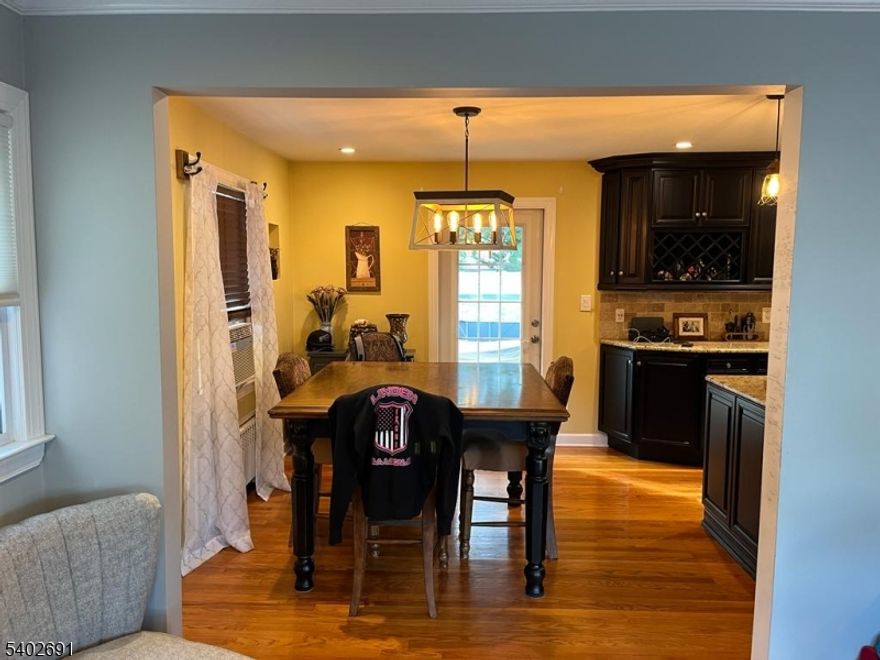 a colonial with three bedrooms and 1.5 bathrooms that has brand-new exteriors. Dimensional roofing, vinyl siding, gutters, leaders, steps, patios, driveways, garage doors made of vinyl, new windows, wood fireplaces, and Sunnyside schools are some of the exterior features.