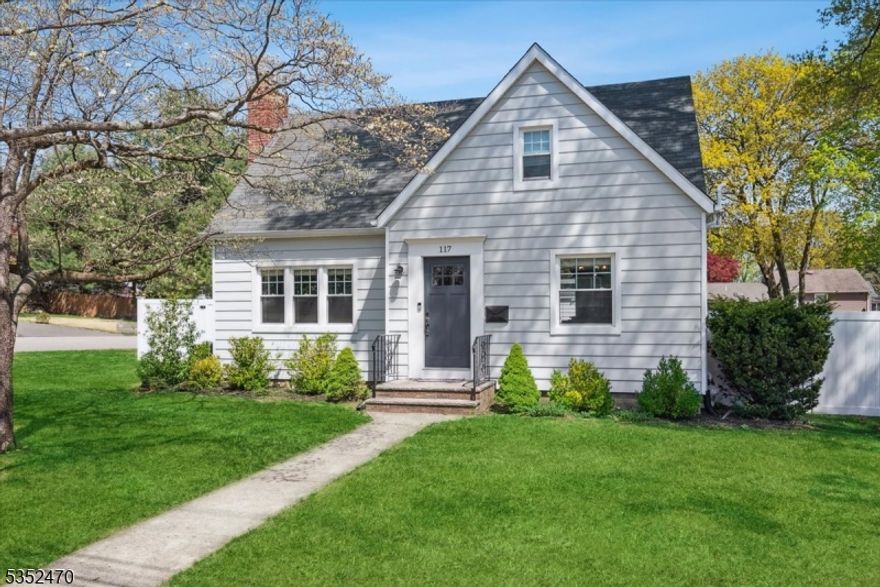 Move right into this beautifully maintained Cape Home that blends classic charm with modern upgrades throughout. Situated on a spacious corner lot with a fully fenced yard, this property offers privacy, space, and outdoor living potential rarely found in the area. Step inside to a thoughtfully renovated kitchen featuring a breakfast bar, stainless steel appliances, striking black granite countertops, and crisp white subway tile backsplashes. The open floor plan flows into a sunlit dining area accented with updated light fixtures and hardwood floors that run throughout the home. The inviting living room centers around a wood-burning fireplace, flanked by built-in bookcases and a raised hearth perfect for cozy evenings. A charming enclosed porch/mudroom greets you at the back of the home and offers the ideal everyday entry from the detached garage, making comings and goings extra convenient. Enjoy the comfort of 2 full bathrooms, one on each level. Additional highlights include: newly replaced windows (2021), new back patio and steps, new vinyl fence and a large oversized detached garage. Major systems have been updated with a newer air conditioning unit, furnace, and hot water heater. Located in the heart of Boonton, NJ, you'll love the small-town charm, easy access to shops, dining, parks, and excellent commuter options and major highways. This is a rare opportunity to enjoy stylish, move-in-ready living in one of Morris County's most convenient locations.