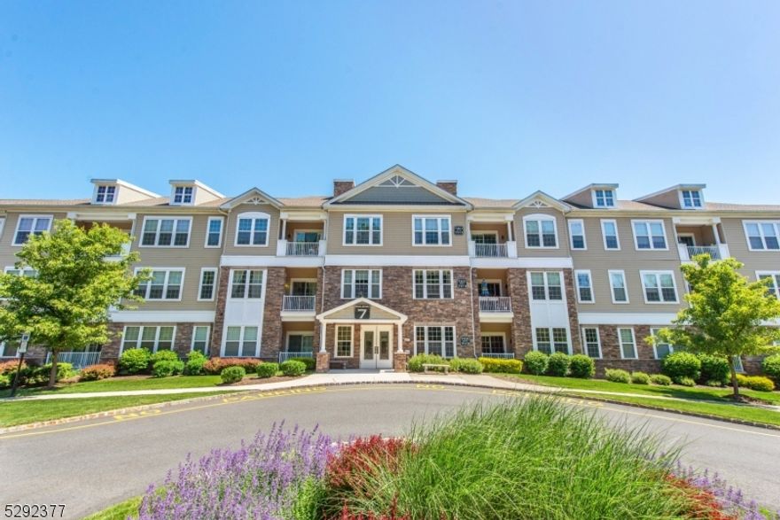 Beautifully maintained open concepts, 2 bedroom 2.5 bath, freshly painted throughout and new flooring! The oversized master suite boasts two walk-in closets, large granite-topped vanities with 2 sinks. An equally impressive second bedroom has its own bathroom and walk in closet. Kitchen has granite countertops, matching stainless steel appliances with accompanying breakfast bar. A well-lit sunroom off living room gives ample opportunity for an office. Side by side washer and dryer in unit (new washer).  Convenient parking in basement garage with 10 by 10 storage space! Plus everything this idyllic community has to offer including large clubhouse with heated indoor pool and sauna, a fitness center, art room, billiards room, card/activity room, outdoor pool with a pavilion, tennis courts, dance/aerobics studio, community garden with individualized plots, hiking trails and much more! Under an hour from NYC and minutes from shopping, groceries and public transportation.