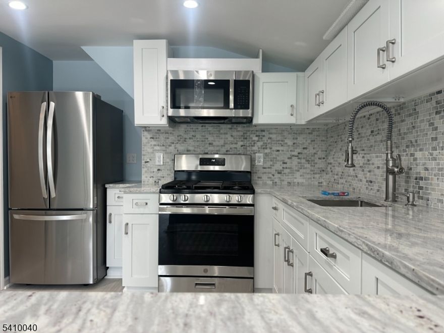 This second level fully renovated one-bedroom apartment with all utilities included, offers modern finishes natural light. Recent renovations include a brand-new kitchen, bathroom, flooring, and new appliances such as a refrigerator, microwave, and stove. The apartment includes a living room, private entrance, and on-site parking. Climate control is provided by a split-system air conditioner and baseboard heating. A washer and dryer are included for convenience. The property is conveniently located with easy access to Route 23, major highways, and nearby shopping. Utilities are included in the rent.