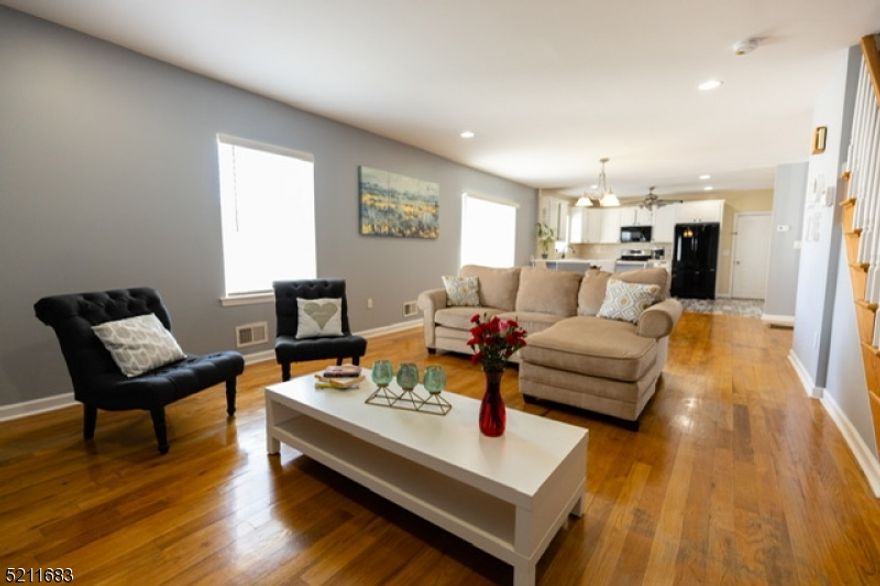 Gorgeous Renovated Colonial in the heart of Roselle Park is ready for new owner! Inviting enclosed porch giving access to the open concept first floor with living room, dining room, eat in kitchen with lots of cabinets and huge pantry, and powder room. Second floor with 3 ample bedrooms, including master with lots of closet space and full bath in hallway. Third floor with one bedroom, family room and full bath. Immaculate unfinished basement with endless possibilities. Kitchen has access to the huge fenced in yard with a gorgeous patio recently done and lots of green space. One car detached garage with a room that could be used for storage (currently used as a playroom).   Double Lot. Lots of parking space, for 4+ cars.  Home has 2 zone central air and heating units. Prime location!  2 blocks of elementary and high school and 3 blocks from Roselle Park Train Station with trains to NYC. A must See!