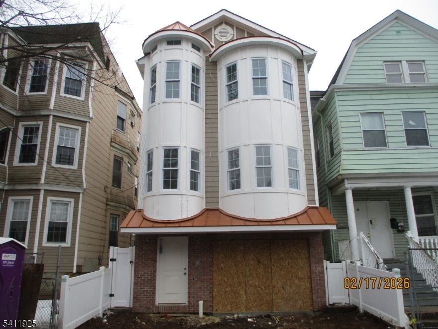The "Heather" model in the Vailsburg section of Newark's west ward. Rare single-family new construction in Newark. 3,477 square feet of luxury living space with 5 bedrooms and 5.5 bathrooms. Ground floor: 2-car built-in garage with recreation room and half-bath in rear. Second floor: living room, dining room, eat-in-kitchen, laundry room, and a master bedroom suite. Third floor: two master bedroom suites and two additional bedrooms. All five bedrooms have walk-in-closets. Premium oak hardwood and ceramic tile flooring throughout. Granite counters in kitchen and all bathrooms. Four-piece stainless steel appliance package in kitchen. Central air conditioning and forced air heat on all levels of home. This is unlike any home ever built in Newark - brought to you by Newark's most renowned developer. Home is eligible for 5 year property tax abatement. Floor plan can be found in media section.