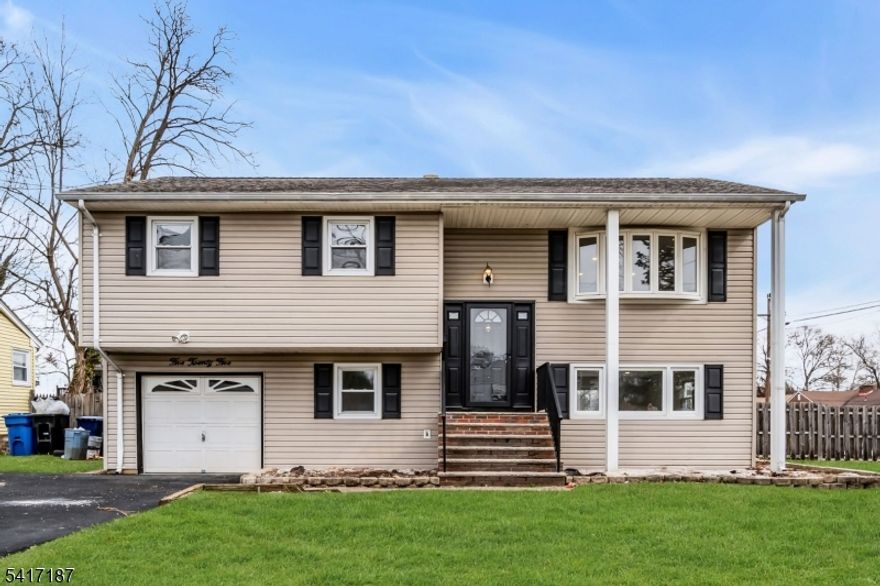 Welcome to 525 Trinity Street, a beautifully updated four bedroom, two full bathroom home situated on a desirable corner lot. This move in ready property features brand new paint and brand new laminate flooring throughout, creating a bright and modern living space. The fully renovated kitchen includes white shaker cabinets, stainless steel appliances, a white subway tile backsplash, and elegant white quartz countertops, perfect for both everyday living and entertaining. The home is filled with tons of natural sunlight, giving it a warm and inviting atmosphere. Additional updates include a new HVAC system, a new driveway, and a one-car garage, providing both comfort and convenience. With its modern upgrades, spacious layout, and prime corner location, this home offers the perfect combination of style and functionality.