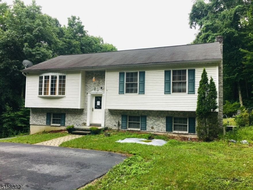 Don't miss this newer, updated bi-level home that backs to stateland! This home features an open concept living area including a large kitchen with a center island/breakfast bar, living room with bay window, and dining room with sliding doors to the deck! The main floor is complete with three bedrooms and a full bath! The ground floor features a fourth bedroom, family room with sliders to the patio/fenced in yard, an exercise room, laundry room, powder room, and tons of storage! Blue Ribbon Schools and much more! Please note, this is a short sale.