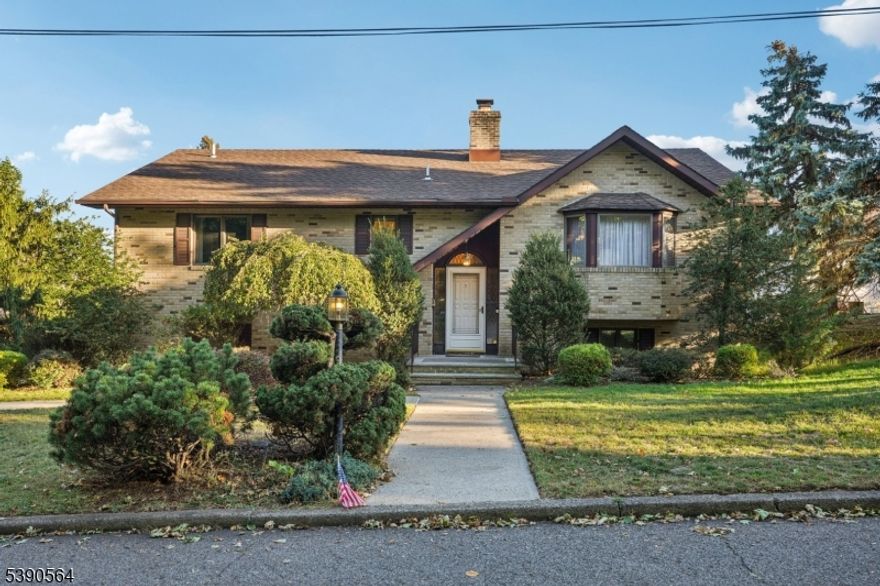 Welcome home to this beautifully maintained 4-bedroom, 3-bath Bi-Level nestled on a manicured lot. This spacious residence offers comfort, flexibility, and convenience for a variety of lifestyles. Step into the inviting entry foyer leading upstairs to the open-concept main living area. The sunlit living room features a large picture window and a welcoming atmosphere ideal for relaxation and conversation. The living room flows effortlessly into the dining room, offering a wonderful setting for intimate meals and lively gatherings. Large cased opening leads into the kitchen, showcasing custom cabinetry, ample counter space, stainless steel appliances, and separate dining area. In the kitchen, you'll find the laundry room for added convenience. First-floor primary bedroom features a large closet, and a private en suite, while a second bedroom and full bath complete this level. The ground floor offers a private in-law suite with its own family room for unwinding, a fully equipped kitchenette with generous cabinetry and counter space, two bedrooms and full bathroom an ideal setup for guests. From the kitchen, step out to the rear deck, perfect for outdoor grilling and al fresco dining, leading down to a patio overlooking the expansive backyard. Ample backyard for gardening, play, or entertaining. Two-car attached garage and generous driveway parking complete this wonderful home, located close to NYC transportation, shopping, and dining.