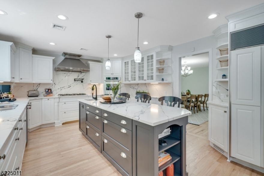 INCREDIBLE 5 Bedroom, 4 Full and 1 Half Bath stunner with FABULOUS 2022-2023 major renovations and modern additions. Nestled on just over 1/2 Acres with expansive living space and open floor plan, located in the heart of the coveted Deerfield section of Short Hills. A welcoming Front Porch. Elegant Living Room. Formal Dining Room. Exceptional Gourmet Kitchen with professionally painted Woodmode cabinetry, 3-seater island with bar sink, Viking/Sub-Zero/Thermador appliances, and NEW showstopper Quartz countertops and backsplash. Dreamy Breakfast Room. Huge, stunning Family Room with stone fireplace and skylights. Fabulous and functional Mud Room and Laundry Room. Many custom built-ins, custom closets, LED recessed lighting, newly refinished hardwood floors, and freshly painted interior throughout. Lower level NEWLY renovated with a large Recreation Room, Bedroom, and Full Bath. Tons of storage. Excellent flow for entertaining and seamless access between indoors and outdoors. Incredible outdoor Deck, Bluestone Patio, and Gazebo with killer sunset views, new grill, and firepit. Comprehensive sprinkler and new security system. This is truly a beautifully renovated, exceptional home with top-rated schools, proximity to New York City, Midtown Direct Train, nearby Short Hills Mall and downtown Millburn shopping and restaurants.