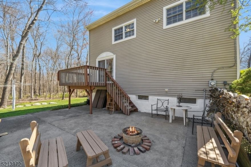 PRIVACY AND CONVENIENCE!!! Lovingly maintained colonial in a super convenient, yet very private location, is looking for new owners!  Backing into the park land this light and bright home features welcoming foyer; living room with gas fireplace; formal dining room with sliding doors to the deck; spacious kitchen with a breakfast bar, granite counter tops, tasteful backsplash; and a full bathroom on the first level.  Second floor offers high ceilings; large master bedroom with walk-in closet, two additional bedrooms, full bath.  Full basement, large patio (with hot tub hook up already there), super private beautiful yard, two sheds complete the picture of an awesome home!  All public utilities!  Come and see for yourself!