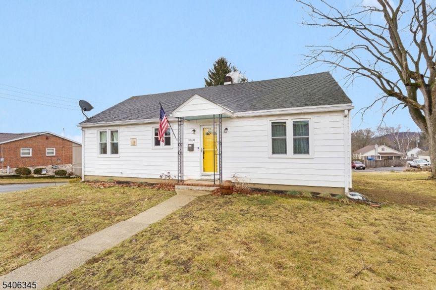 Welcome home to this well-maintained ranch-style residence offering the ease of condo living without shared walls or HOA fees. The home features two bedrooms and two full bathrooms, along with a partially finished walk-out basement providing a third bedroom (as per tax assessor) or flexible living space. Recent updates include new flooring, fresh interior paint, and updated bathrooms. The kitchen offers newer appliances, ample cabinetry, and an efficient layout suited for everyday living.A three-season room expands the main living area and overlooks the spacious yard, creating a comfortable transition between indoor and outdoor living. The property includes an extra lot totaling approximately .28 acres, a private garden area, and an outdoor fire pit, offering space to enjoy without the maintenance demands of a larger property. A one-car garage provides convenient parking and storage.Located near shopping, dining, parks, and recreational amenities, with easy access to Route 22, Interstate 78, and major commuting routes, this home offers a rare combination of privacy, outdoor enjoyment, and low-maintenance living.