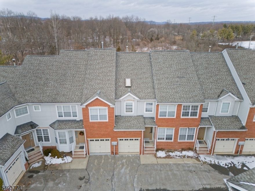 Very well maintained large & bright Abbey unit - Open lay out. Private location backing to preserve. Living Room with gas fireplace, recessed lights, dining room with slider to deck & lawn. Eat in kitchen with breakfast nook & pantry - Granite counters & newer stainless steel appliances. Second level has Master suite with walk in closet, skylights, shower & jetted tub. 2 other bedrooms, both baths have double vanities & convenient second floor laundry. Finished spacious basement has newer carpet - family room or media room, full bath & storage. Gas heat, central Air & city utilities. Additional assigned parking close to front door. Pool & club house in the complex. Walking access to bus park & ride to NYC & shopping. tenant is responsible for first $ 150 in repairs per occurrence & obtain renters insurance. 1.5 month security deposit & first month rent will be due upon acceptance of the application.