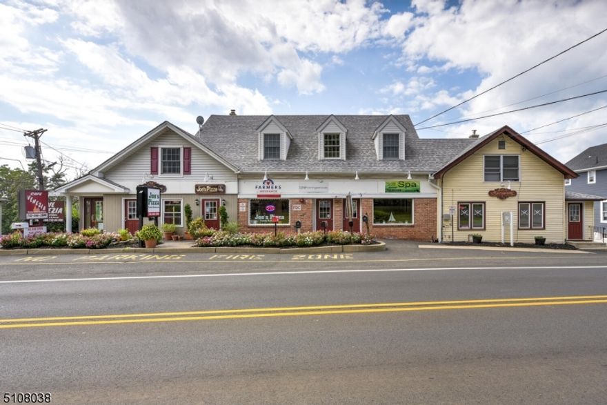 17,281 Sq Ft provided by Tax Assessor. Mixed use: Restaurant, Pizzeria, Hair Salon, Spa, Offices and 2 apartments. Superb location in the Village of Martinsville!Excellent investment opportunity
