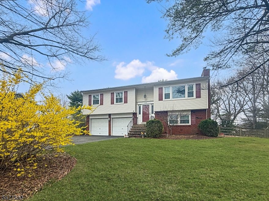Spacious 4-bedroom bi-level home located in the highly desirable Brakely Park section of Lopatcong. The main level features a bright, updated kitchen with maple cabinetry, granite countertops, and stainless steel appliances, along with sliding doors that open to a deck perfect for outdoor entertaining. This level also offers a formal dining room, three well-sized bedrooms, and a full bathroom. Hardwood floors flow through the living and dining areas, complemented by a cozy fireplace that adds warmth and character. The ground level provides additional living space with a comfortable family room, a fourth bedroom, and a convenient half bath ideal for guests. A walkout basement adds even more flexibility for storage, recreation, or future finishing. Enjoy outdoor living with both a deck and a covered patio, offering multiple spaces to relax or entertain. Conveniently located near shopping, medical facilities, and dining, this home combines comfort, style, and accessibility.