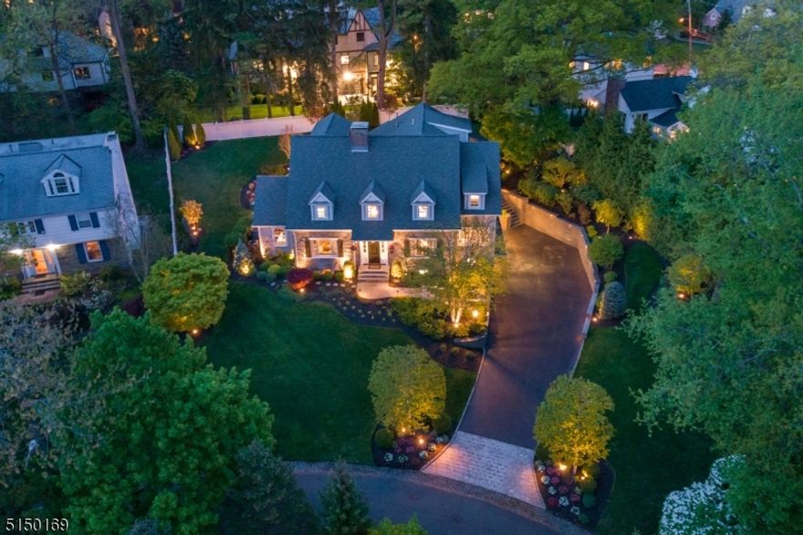 MAGAZINE WORTHY GEM located in the heart of prestigious Old Short Hills incredibly close to Glenwood School, Short Hills Train Station, Hartshorn Arboretum. Perched beautifully on a tree-lined winding street, this stunner has been brilliantly renovated from top to bottom w/ every modern convenience imaginable. All renovations/additions, indoor & out, are exacting to meld seamlessly w/ the original home. Fantastic for entertaining on any scale. One-of-a-kind Gourmet Chef's Kitchen w/ Hibachi Grill, Kegerator, Wolf/Sub Zero/Miele appliances & magical Breakfast Room. Sundrenched Family Room off Kitchen w/ coffered ceiling opening up to idyllic backyard. 2 Home Offices! Elegant Living & Dining Rooms. Butler's Pantry. "Smart  home w/ every high-tech upgrade imaginable. Glorious Primary Suite w/ Walk-In Closet for 2 & bath rivaling a 4 Seasons. All other bedrooms sundrenched w/ custom closets & on-trend baths (all ensuite or Jack & Jill). Third Level w/ fantastic Home Theater w/ Wet Bar/Kitchenette, Guest Suite, Half Bath & abundant storage. Lower Level w/ gorgeous 1400 Bottle Wine Room, Recreation Room, Custom Built-Ins, fabulous Mud Room w/ custom storage, Server/IT Room, Full Bath & 2 Car Garage. Desirable 2nd Floor Laundry & auxiliary Laundry in Mud Room. Extremely private, lush property, outstanding outdoor entertainment spaces including hand cut stone hardscaping, wraparound Bluestone Patio, Fire Pit & perennial gardens. Every inch of this home must be seen to be appreciated!