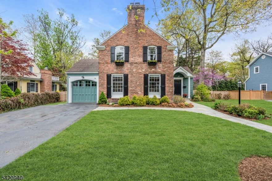 Chatham Charm At Its Finest! Welcome to this beautifully maintained 3-bedroom, 2.1-bath custom home ideally located on one of Chatham Borough's most coveted streets, just a short walk to the train, downtown shops, restaurants, and top-rated schools. A welcoming foyer with slate flooring opens to a sunny living room with fireplace, flanked by built-ins and window seats, creating a warm and inviting first impression. The home flows seamlessly into a spacious kitchen featuring a large granite center island, skylights, and modern appliances, along with a convenient side mudroom entry. Just beyond, the family room is filled with natural light from oversized windows and connects seamlessly to the outdoor patio perfect for everyday living and entertaining. The gracious dining room offers ample space for large gatherings. Upstairs, the expansive primary suite includes: soaring ceiling height, en suite bath, walk-in closet, and surprise laundry chute. Two additional generously sized bedrooms and a full hall bath complete the second level, with potential flexibility to convert to a four-bedroom layout, if desired. The lower level provides versatile space currently used as a gym, craft room, and laundry, ready to adapt to your lifestyle. Outside, enjoy a private fenced-in backyard with mature landscaping, ideal for relaxing, gardening, or entertaining. A rare opportunity to own a thoughtfully designed home in one of Chatham Borough's most desirable locations!