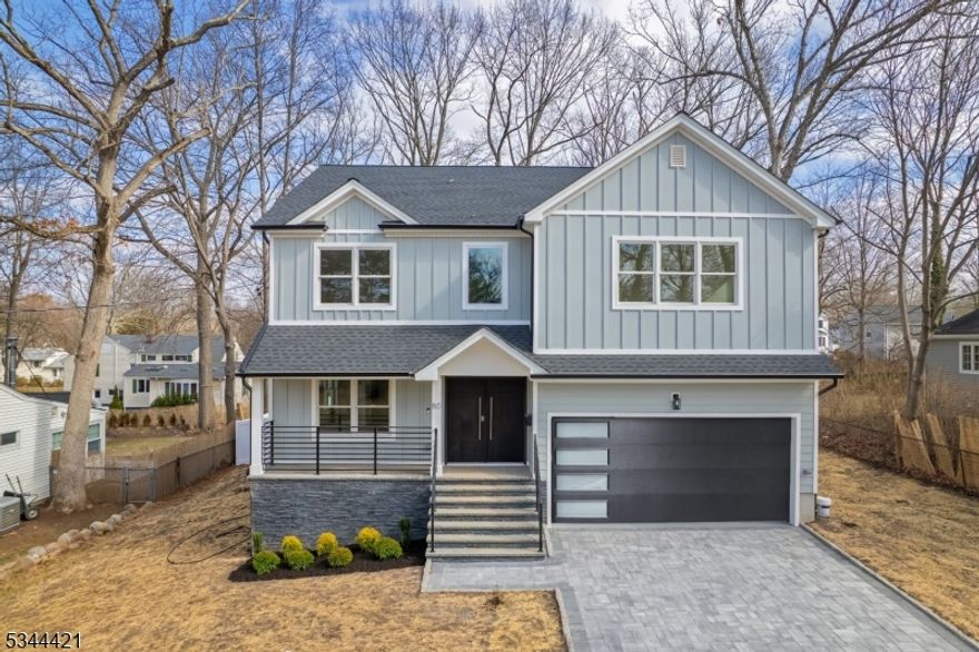 Discover this exquisite new colonial home in one of Livingstons most sought-after neighborhoods.Step through the covered entry porch into a grand double-height foyer,where an abundance of natural light enhances the home's bright and airy ambiance.The main level features a beautiful open layout,including a formal living room,an elegant dining room,a guest ensuite,and a stylish powder room.The gourmet eat-in kitchen is a chefs dream,equipped with custom cabinetry,spacious center island,high-end stainless steel appliances.Sun-drenched and inviting,the family room showcases an elegant fireplace and sliding doors leading to a deck and patio perfect for outdoor entertaining in the flat backyard.Upstairs,are 4 generously sized bedrooms,filled with natural light,a luxurious primary suite featuring his and her walk-in closets,a spa-like bathroom with a soaking tub,stall shower,and dual sinks.The primary suite boasts a private balcony,offering a tranquil retreat.The finished basement offers large open spaces with lots of windows,an office,walk-in closets,a large recreation room,and a full bathroom.Additional modern features include electric car wiring in the garage and a battery backup system for the garage door,ensuring convenience and reliability.This smart home is designed for ultimate comfort and peace of mind.Conveniently located near shopping,top-rated schools,parks,and direct bus service to NYC,this home offers both elegance and convenience.